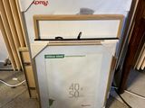 a refrigerator and freezer sitting on the floor in front of a radiator