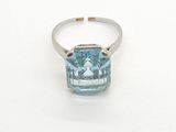 an image of a ring with a blue topazt stone in it