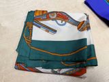 a close up of a folded handkerchief with a tie on it