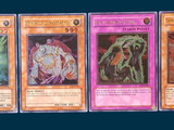 four cards of different colors and designs on a blue background