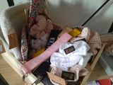a wooden box filled with various items on a table