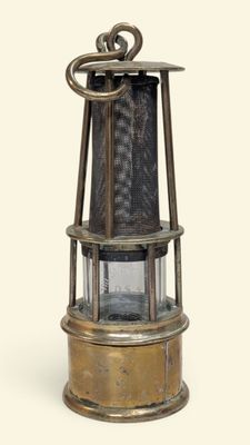 a small metal light that is on top of a table
