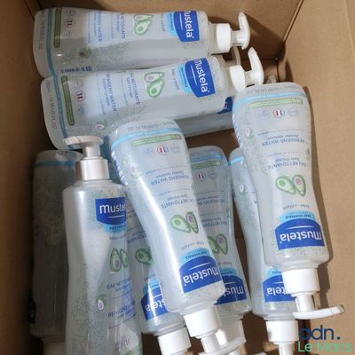 five bottles of hand sanitizer in a cardboard box