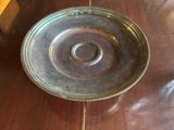a metal bowl sitting on a wooden table