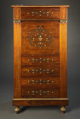 an old wooden cabinet with drawers and a clock on top
