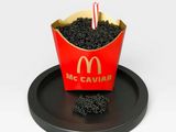 a mcdonald ' s cupcake with a candle in it