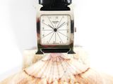 a watch that is sitting on top of a shell