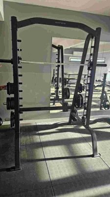 a gym with a lot of equipment in the room
