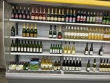 many bottles of wine on the shelves in the store