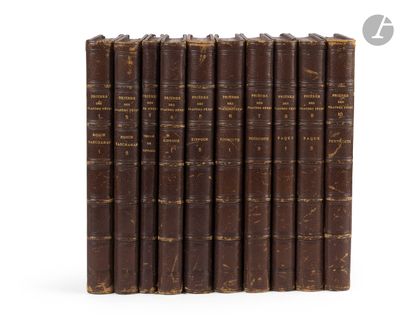 six old books lined up in a row on a white surface