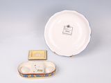 a small plate and a small bowl sitting on a table