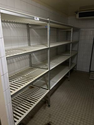 a room with a bunch of shelves in it