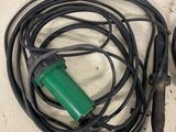 a green cord and a black cord on a table