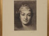 portrait of a woman in a gold frame with a black and white image