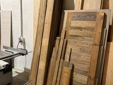 several pieces of wood are stacked on a table in a room