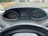 a car dashboard with two speedometers and a steering wheel