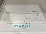 the display case is full of many different necklaces and bracelets