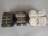 three stacks of folded towels sitting on top of each other