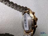 a close up of a watch with a bar code on it