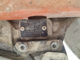 a close up of a metal plate on the underside of a vehicle