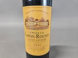 a bottle of wine that is sitting on a table