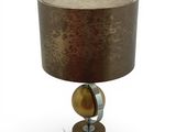 a close up of a lamp on a table with a brown shade