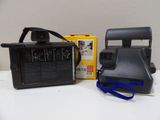 a polaroid camera sitting on a table next to a box