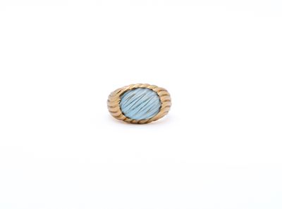a close up of a ring on a white surface