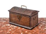 a small wooden box with a handle on a table