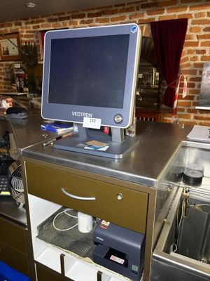 an image of a kitchen with a computer on the counter