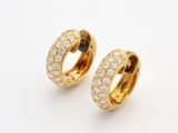 a pair of gold and diamond hoop earrings