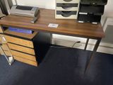 a desk with a computer and printer on top of it