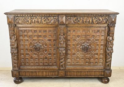 an old wooden cabinet with carvings and carvings on the doors