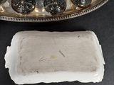 a silver tray with wine glasses on it next to a silver tray with wine glasses on it