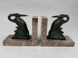pair of bronze bookends with a bird on a leafy base