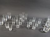 several shot glasses are lined up in a circle on a table