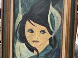 painting of a woman in a blue dress in a green frame