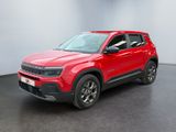 the red jeep compass is parked in a room with a black floor