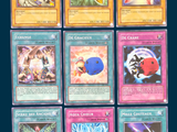 a lot of different pokemon cards on the table