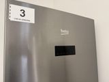 a stainless steel refrigerator with the number 3 on it