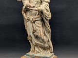 a statue of a woman holding a child in her arms