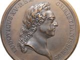 une image représentant une médaille de bronze sur laquelle figure la tête d'une femme