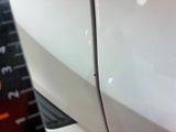 a close up of a car ' s door handle with a sticker on it