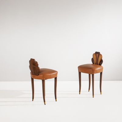 pair of art deco chairs in the manner of person