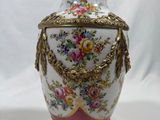 a vase that is sitting on a white surface