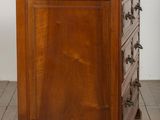 an image of a wooden chest of drawers on a hard wood floor