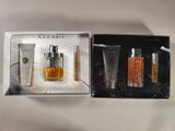 an image of a box containing a bottle of perfume and a tube of lotion