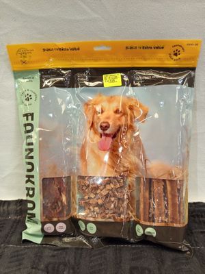 a bag of dog food with a golden retriever sitting on top of it