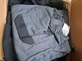 a box with clothes inside of it on the floor