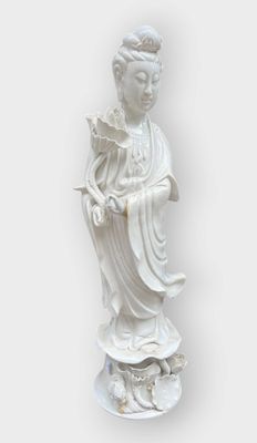 white statue of a woman holding a flower on a white background